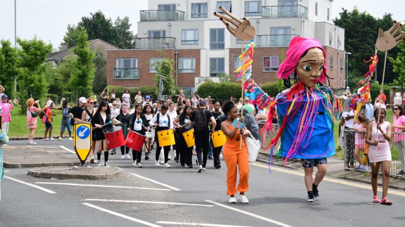 Procession with giant puppet of a woman at Whitley Carnival 2023